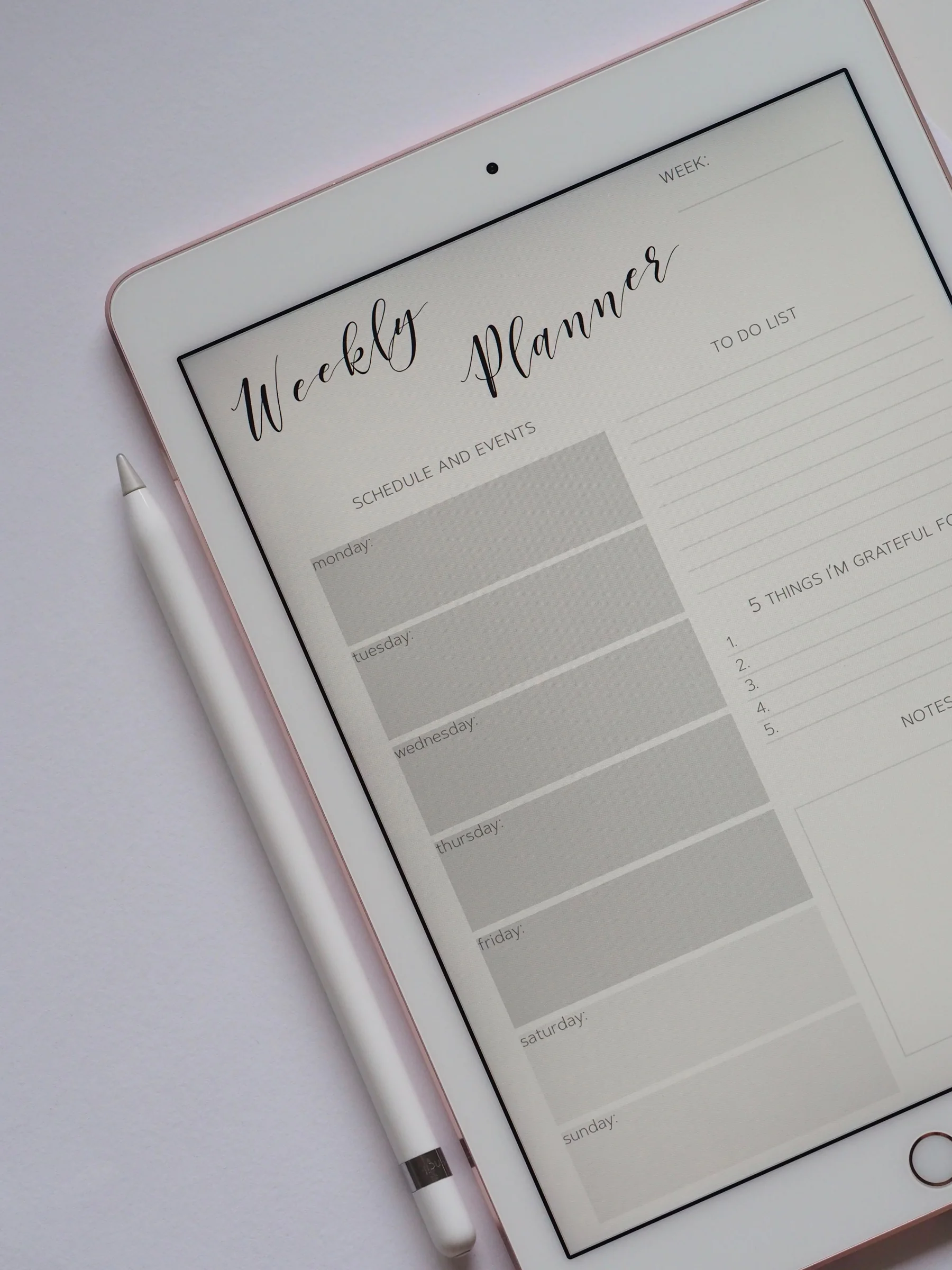 Digital weekly planner displayed on a tablet with a stylus